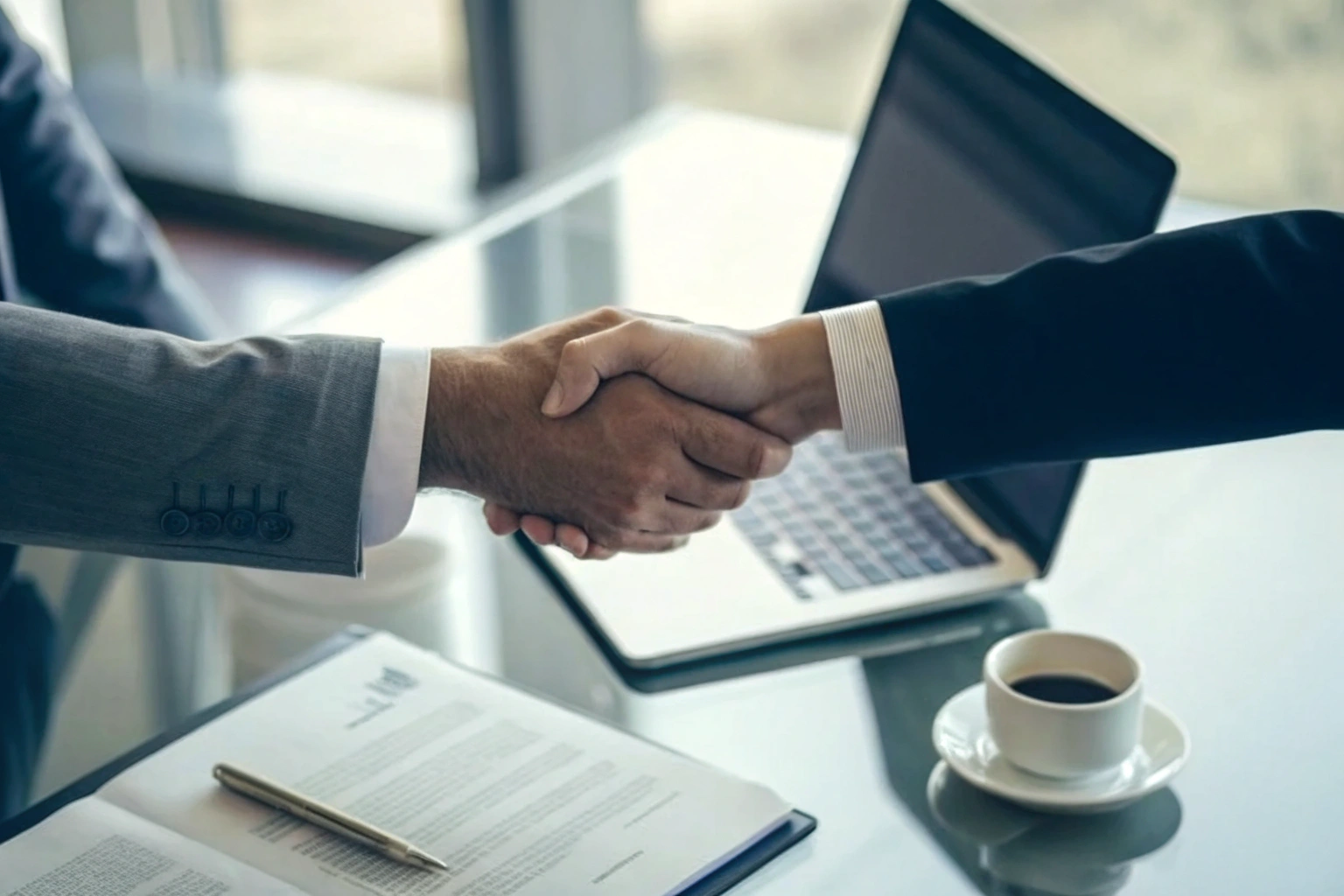 Business handshake finalizing trade agreement