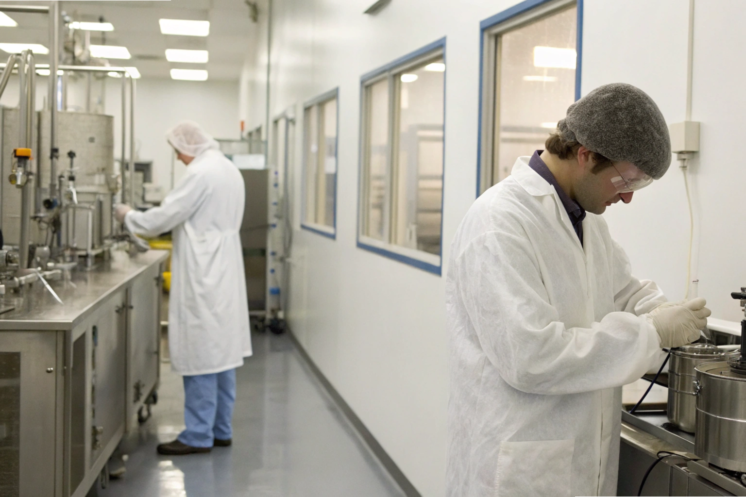 Cleanroom work Technicians working in cleanroom laboratory