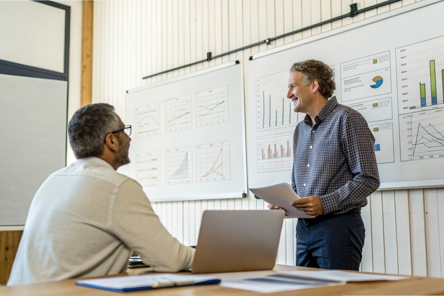 Business meeting analysis Team discussing project performance charts in meeting (ID#5)