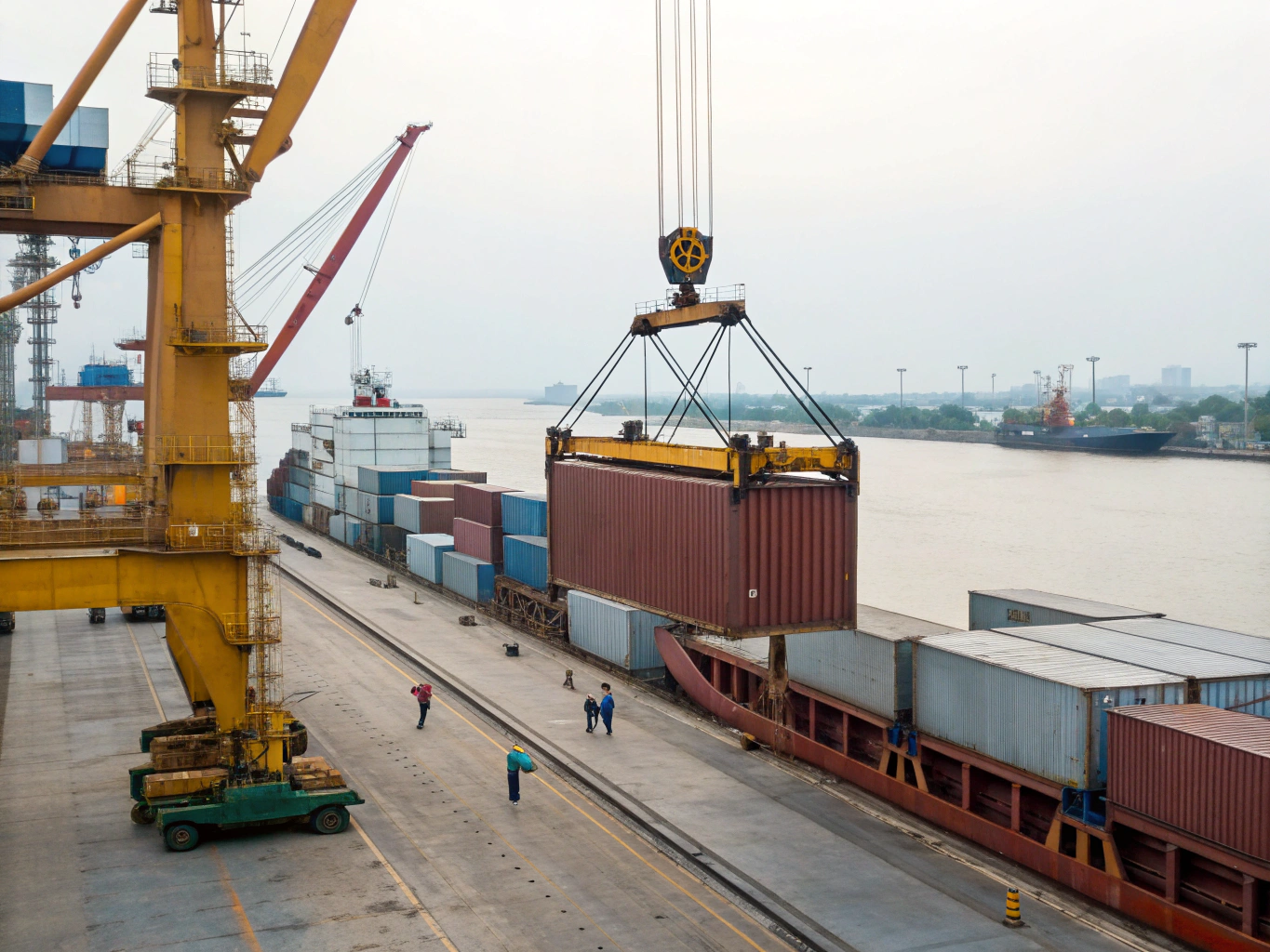Port loading operation Container being loaded onto large vessel at dock (ID#2)