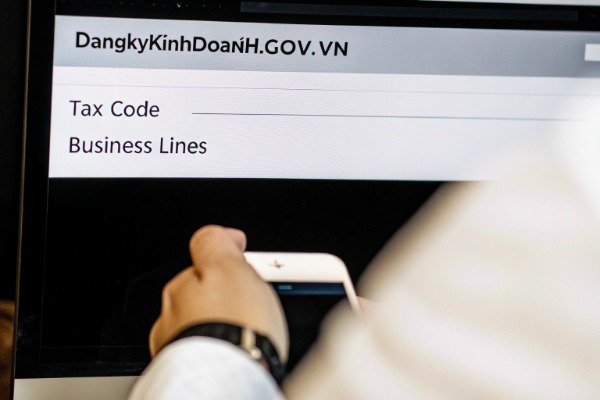 Close-up of computer screen showing Vietnamese business registration (ID#2)