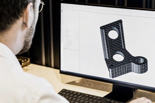 Designer working on 3D CAD model on computer (ID#3)