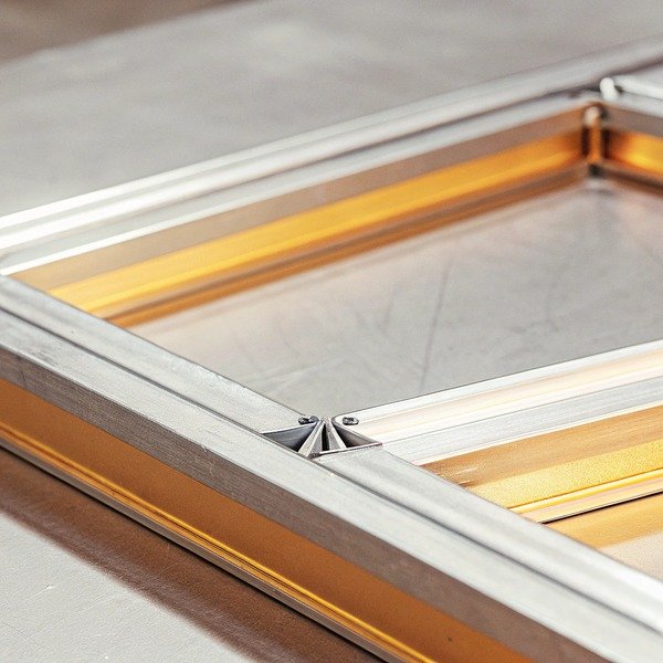 Close-up of metal frame with yellow accents (ID#1)