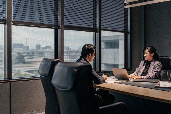 Business meeting in office with city view (ID#5)