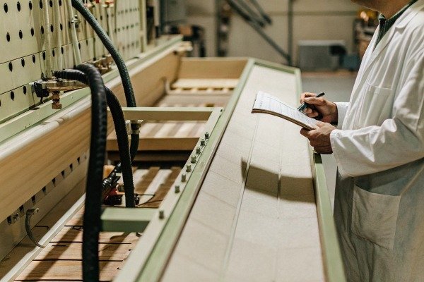 Technician checking production line equipment (ID#4)