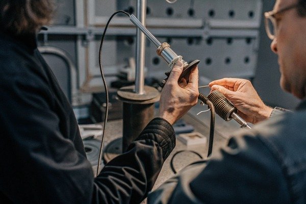 Two technicians soldering electronic components (ID#5)