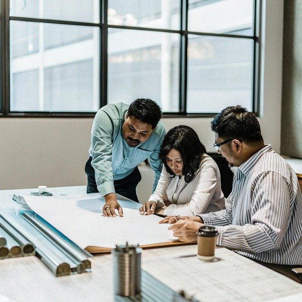 Team collaborating on project plans (ID#1)