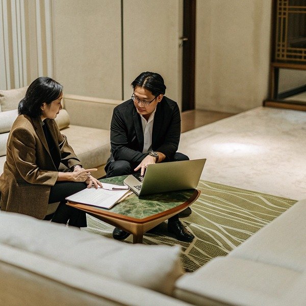 Business meeting with laptop and documents (ID#1)