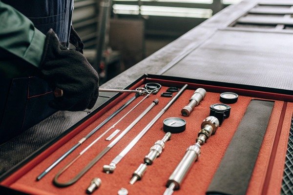 Technician handling precision metal tools set (ID#5)