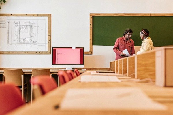 Classroom with two people discussing plans (ID#5)