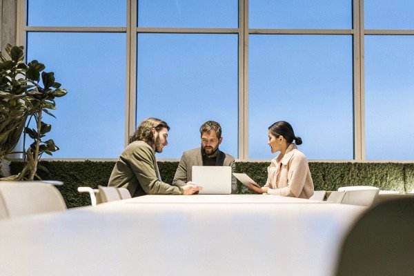 Business meeting with three professionals in office (ID#5)