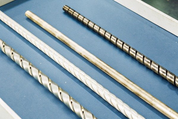 Close-up of metal rods on blue surface (ID#2)