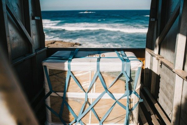 Cargo secured with netting near ocean (ID#5)