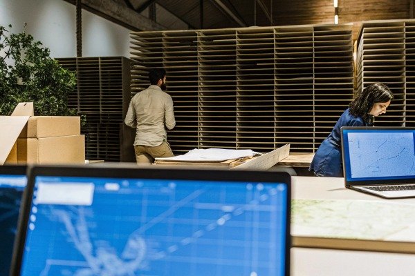 People working in warehouse with computer screens (ID#4)