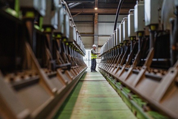 Worker checking machinery in industrial plant (ID#4)