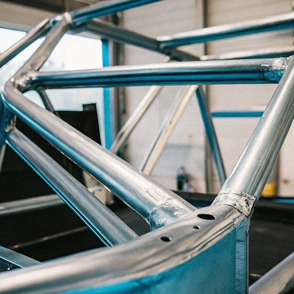 Close-up of metal frame structure in workshop (ID#1)