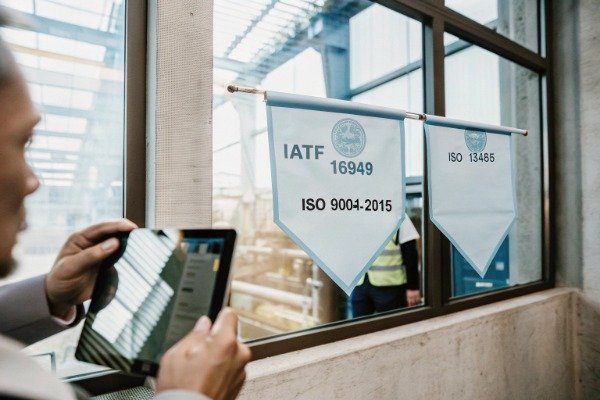 Factory reception showing ISO certificates and quality signage (ID#1)