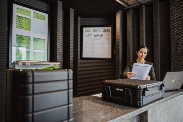 IATF 16949 and ISO 9001 certificates on desk (ID#2)