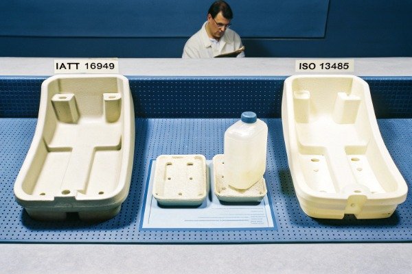 Engineer inspecting specialized parts for IATF and ISO compliance (ID#2)