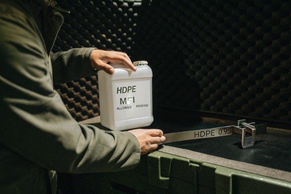 Engineer measuring HDPE wall thickness for RFQ (ID#3)